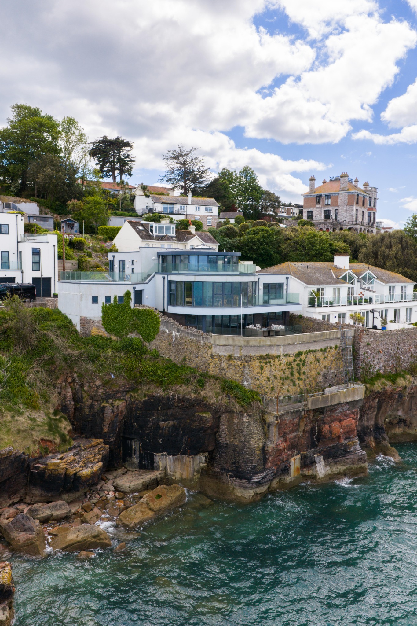Waypoint’s curved glazing and terraces above the shoreline